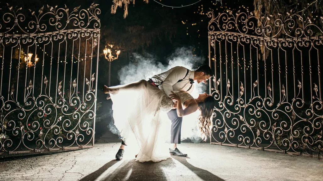 Couple at their wedding, dramatic dip shot