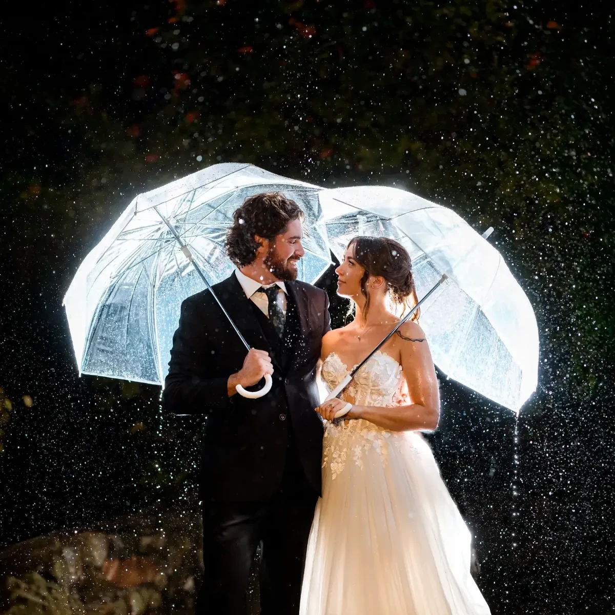 Sarina + Cameron glowing umbrellas in the rain